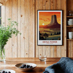 Devils Tower National Monument travel poster art print in black frame on rustic kitchen wall