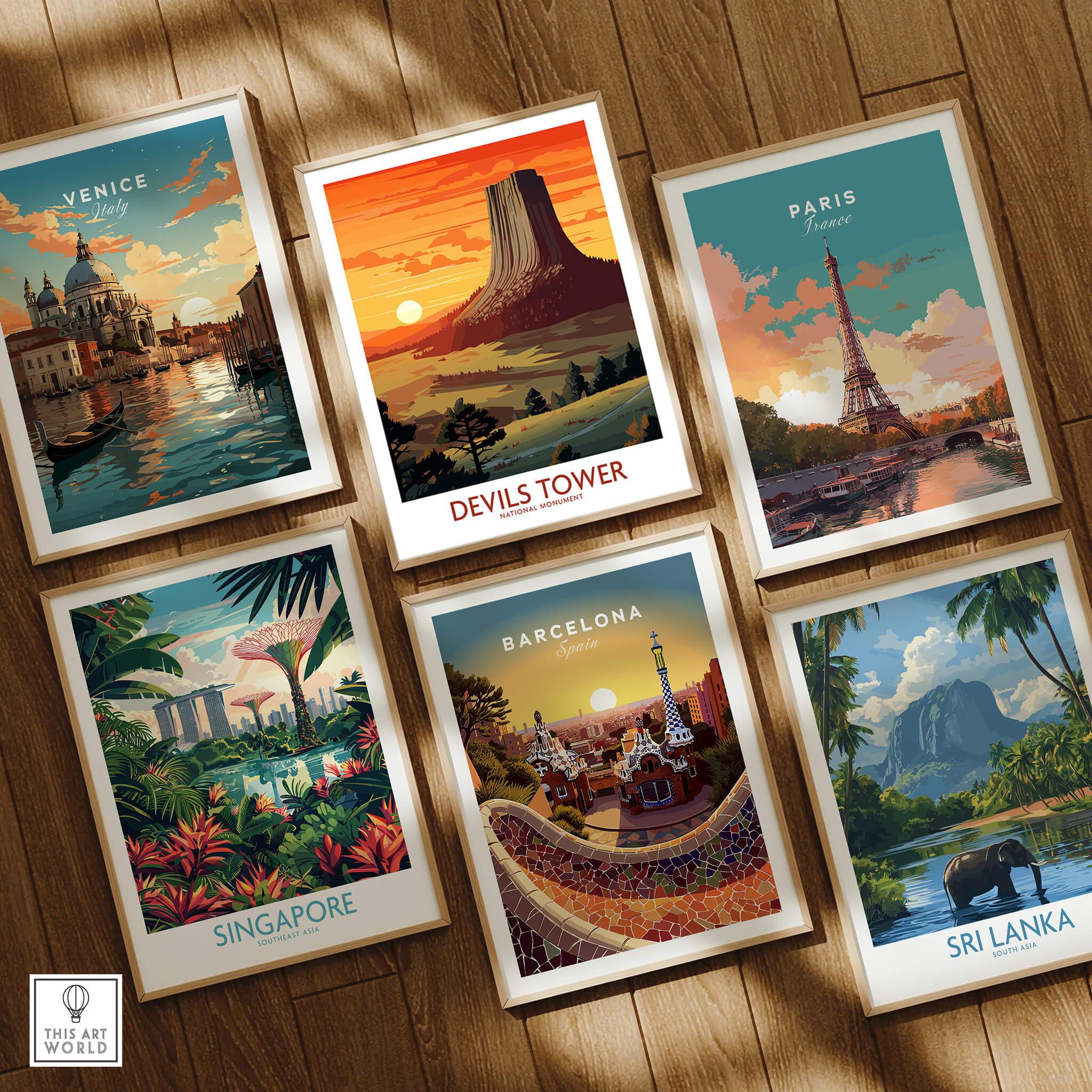 Set of six framed travel art prints featuring Venice, Devils Tower, Paris, Singapore, Barcelona, and Sri Lanka, displayed on a wooden floor.