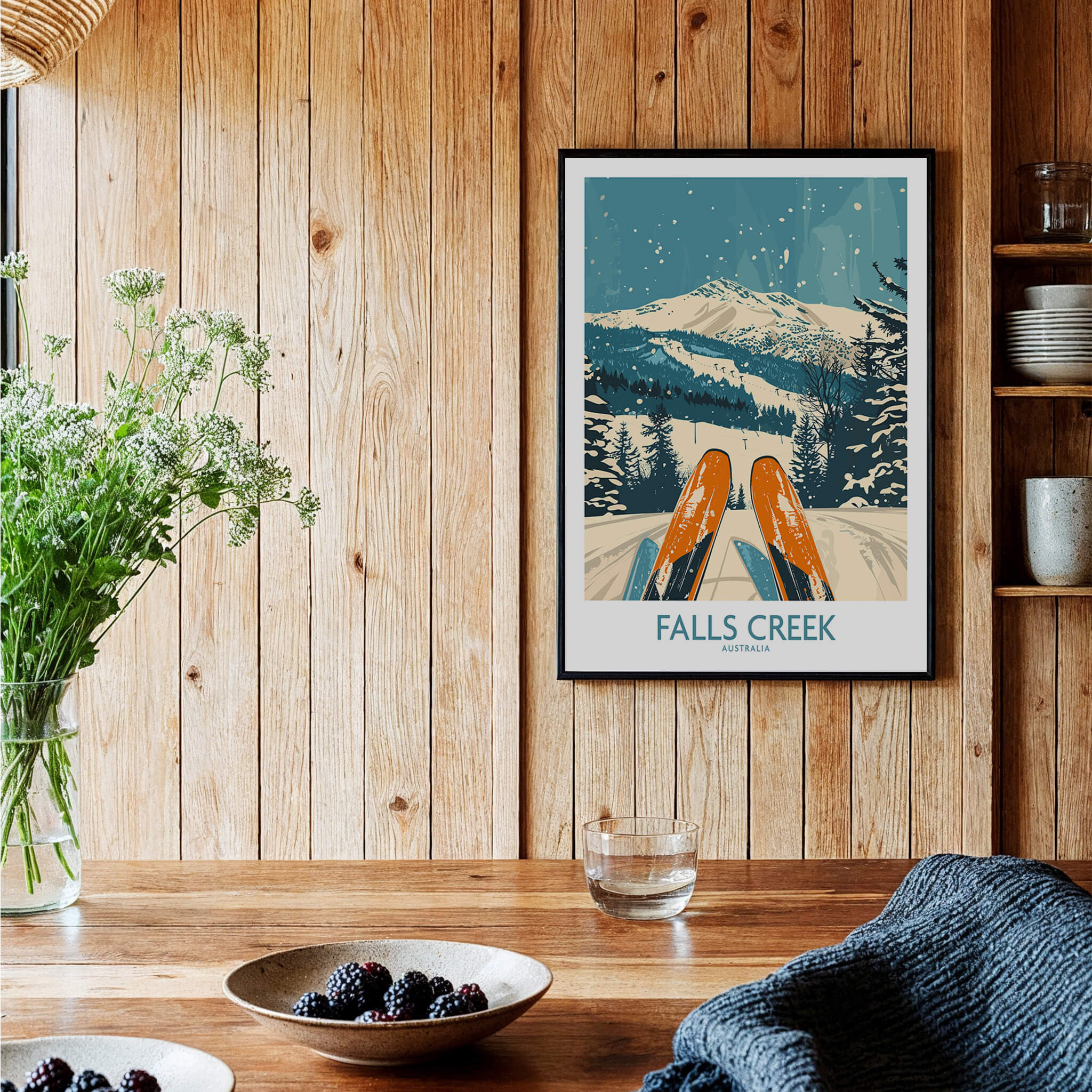 Falls Creek Ski Poster showcasing vibrant ski gear and a snowy mountain backdrop in a cozy home setting.
