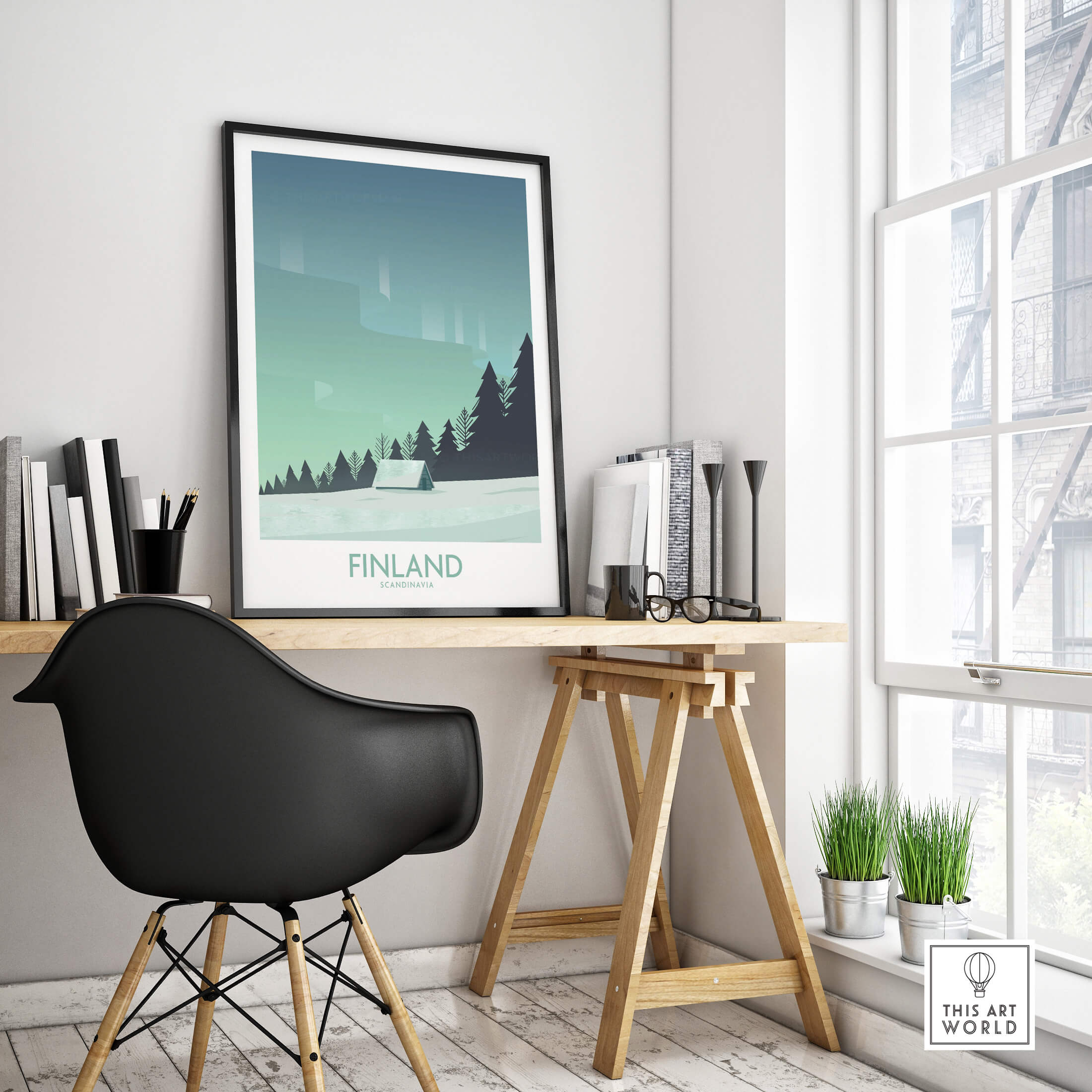Finland Print Travel Poster displayed in a modern interior setting with a stylish desk and plant.