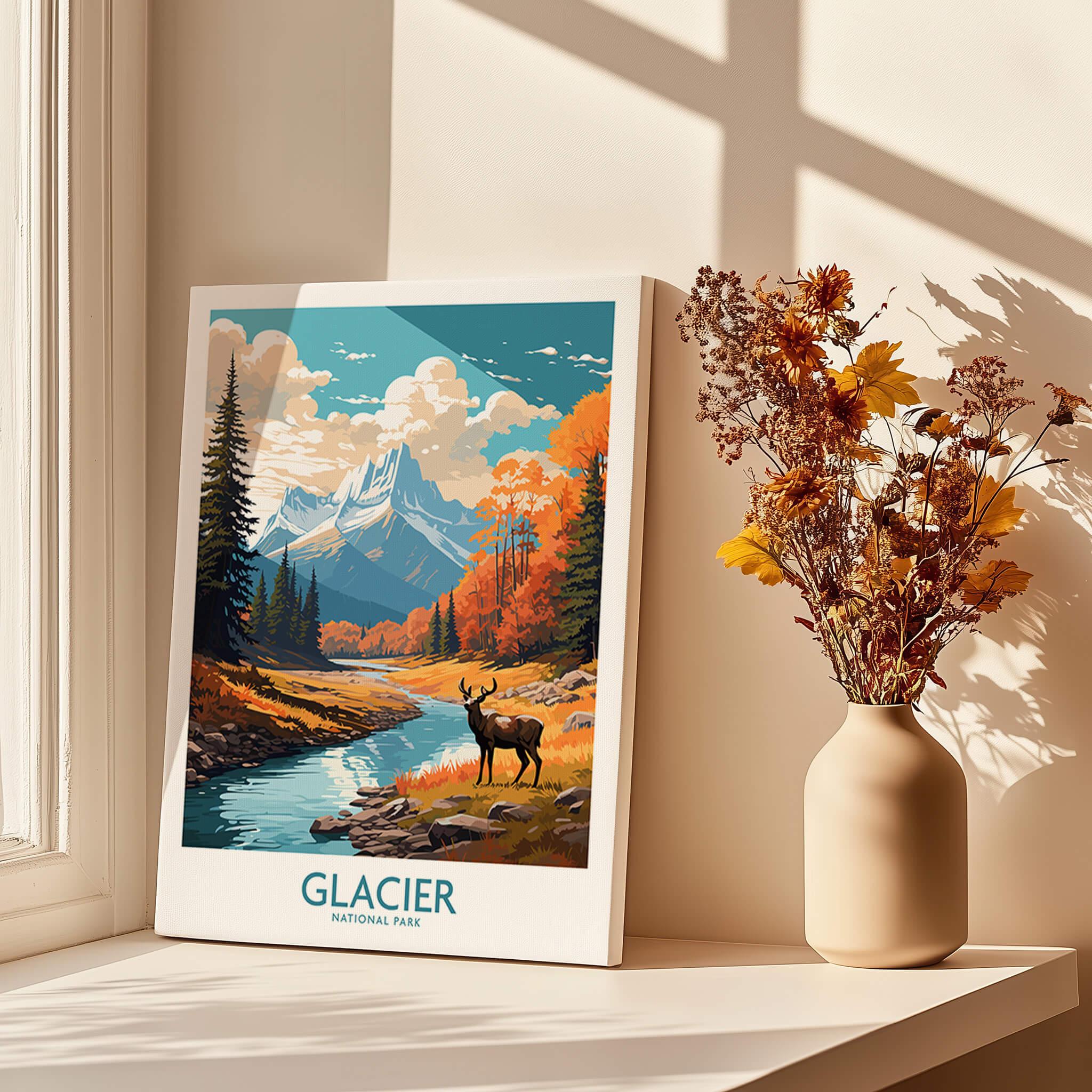 Glacier National Park art print with river, elk, and autumn trees on windowsill beside flowers