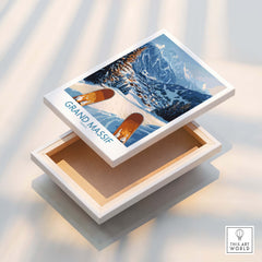 Grand Massif Ski Wall Art Print displayed on a wooden box showing snowy mountains and ski slopes.