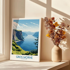 Gros Morne National Park wall art poster on windowsill beside vase with dried flowers in sunlight