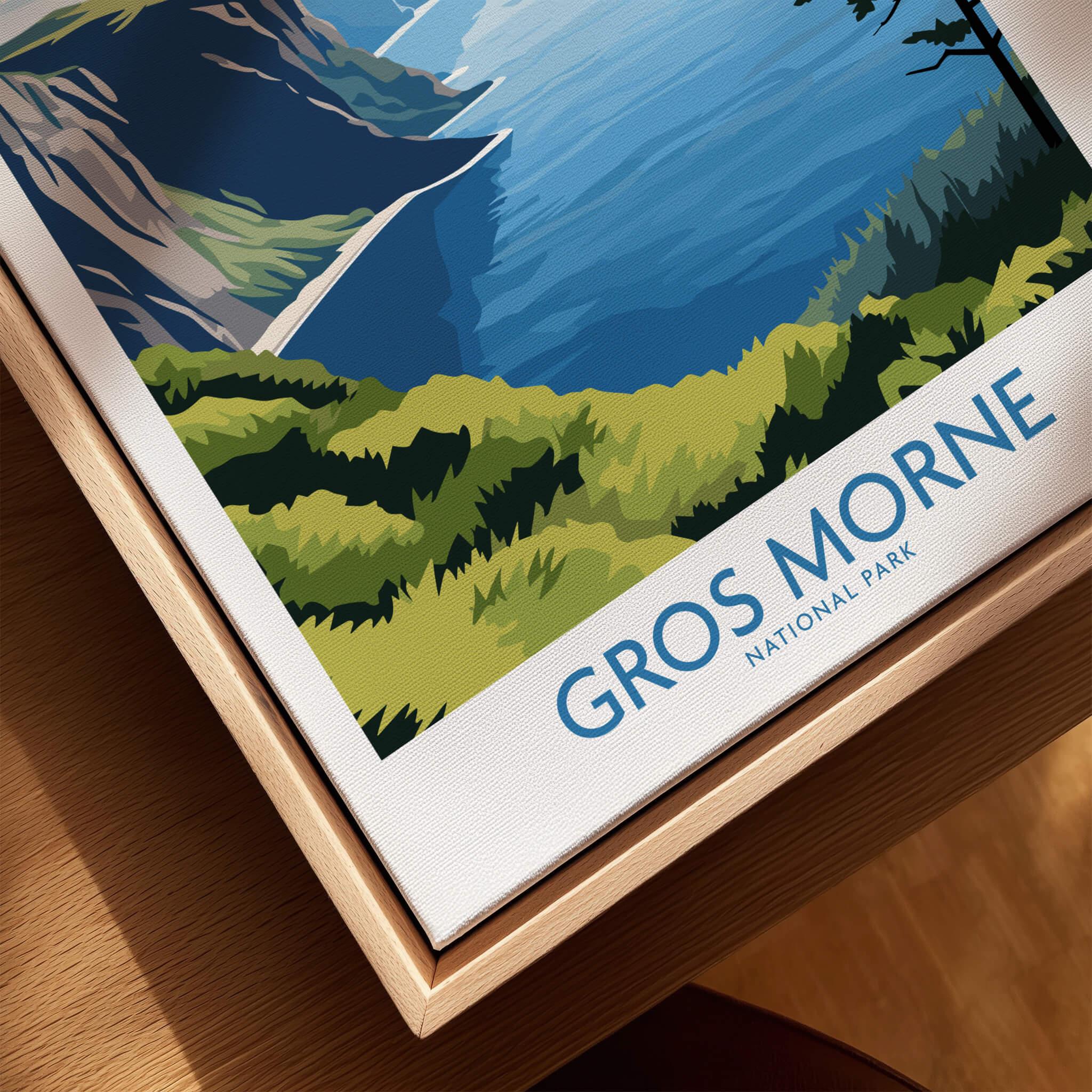 Framed Gros Morne National Park print closeup showing mountains, greenery, and blue lake.