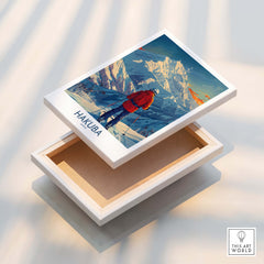 Hakuba Wall Art Print Japan displayed on a wooden box, showcasing vibrant mountain landscapes and a skier.