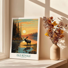 Isle Royale National Park art print with moose, displayed on windowsill next to vase of dried flowers