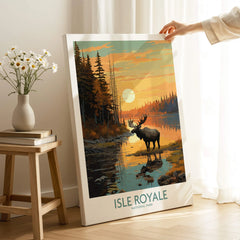 Isle Royale National Park canvas art print with moose, forest, and sunset, held in cozy room