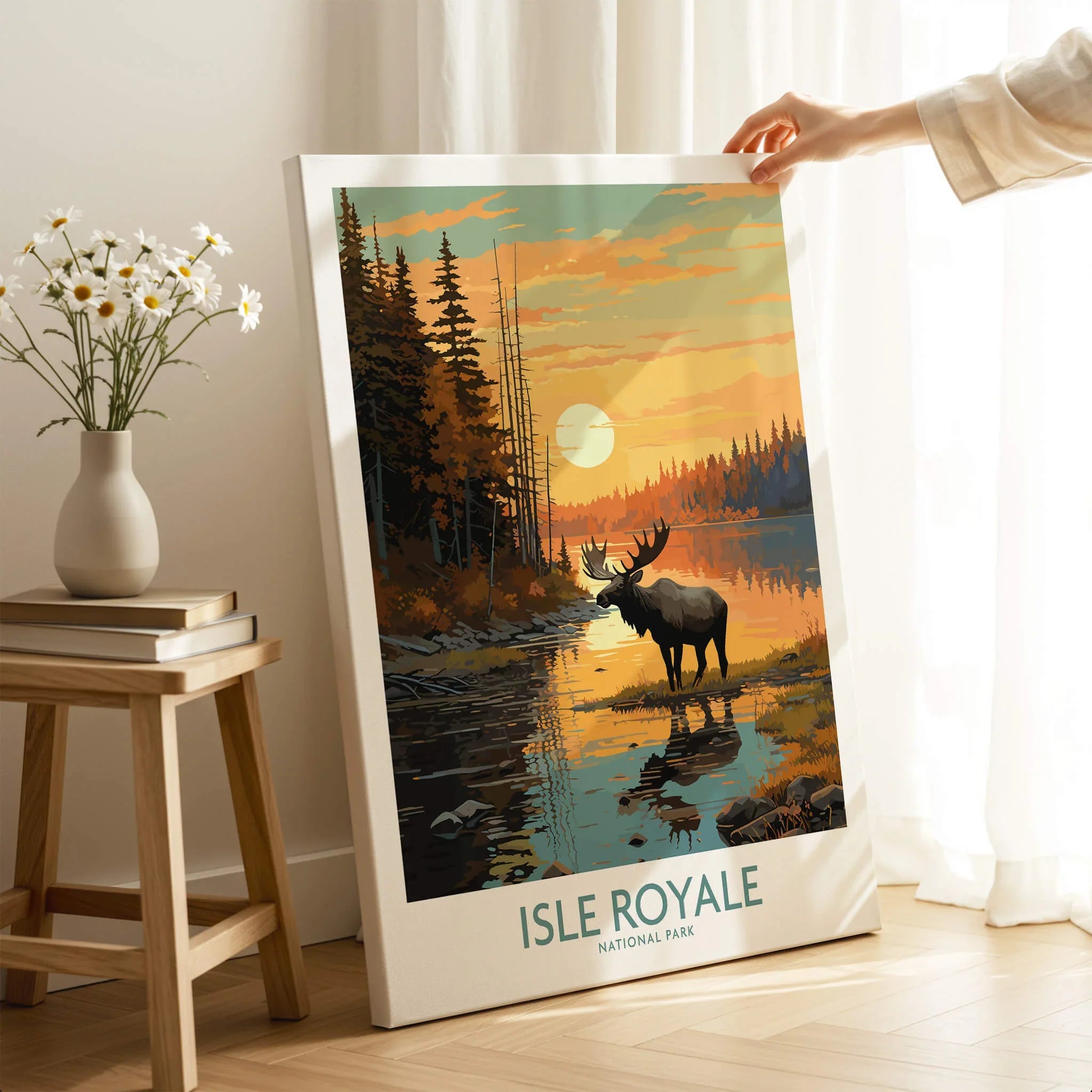 Isle Royale National Park canvas art print with moose, forest, and sunset, held in cozy room