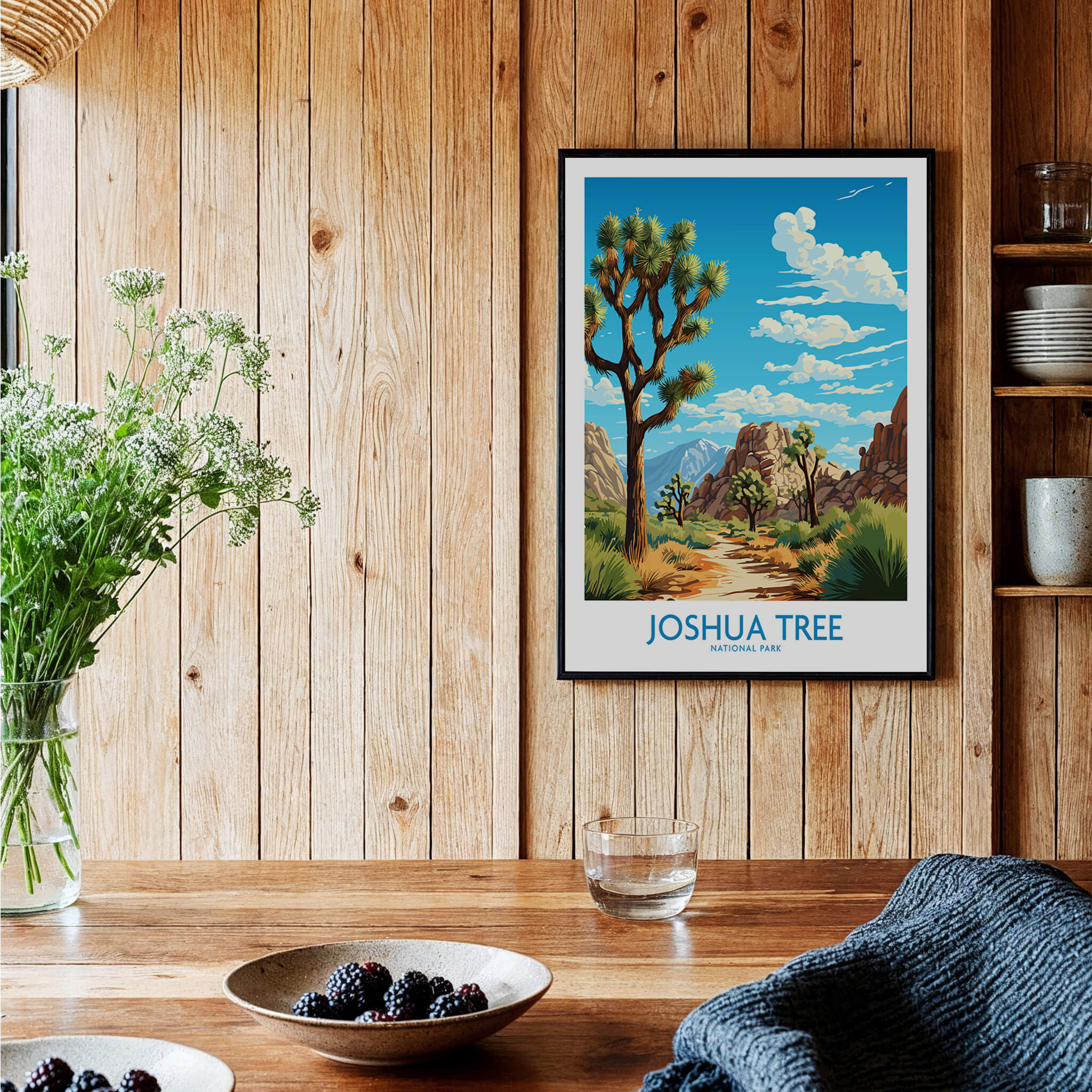 Joshua Tree Print framed on a wooden wall, depicting the California desert landscape with vibrant colors.