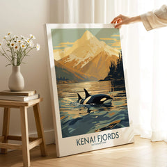 Kenai Fjords National Park art print featuring orca in water with mountain backdrop, displayed in a cozy room.