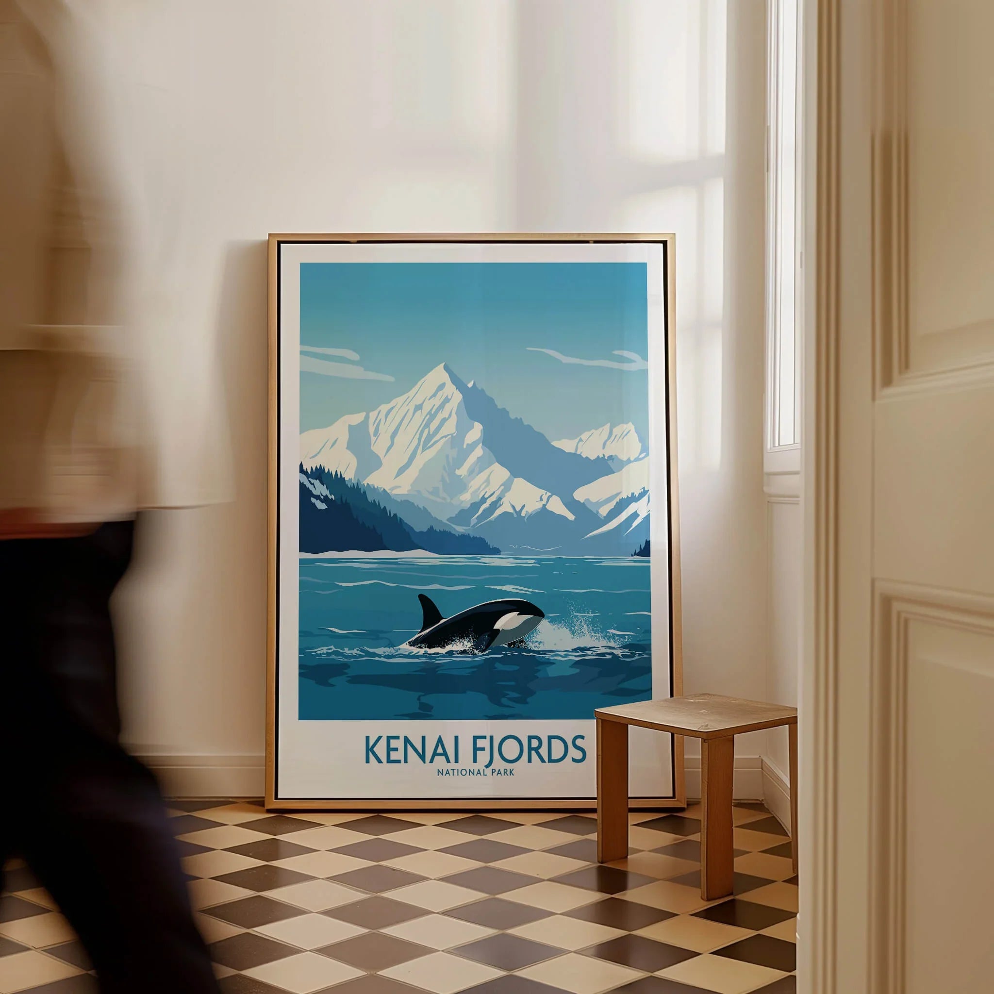 Framed Kenai Fjords National Park travel poster with orca and mountains on floor, man walking past