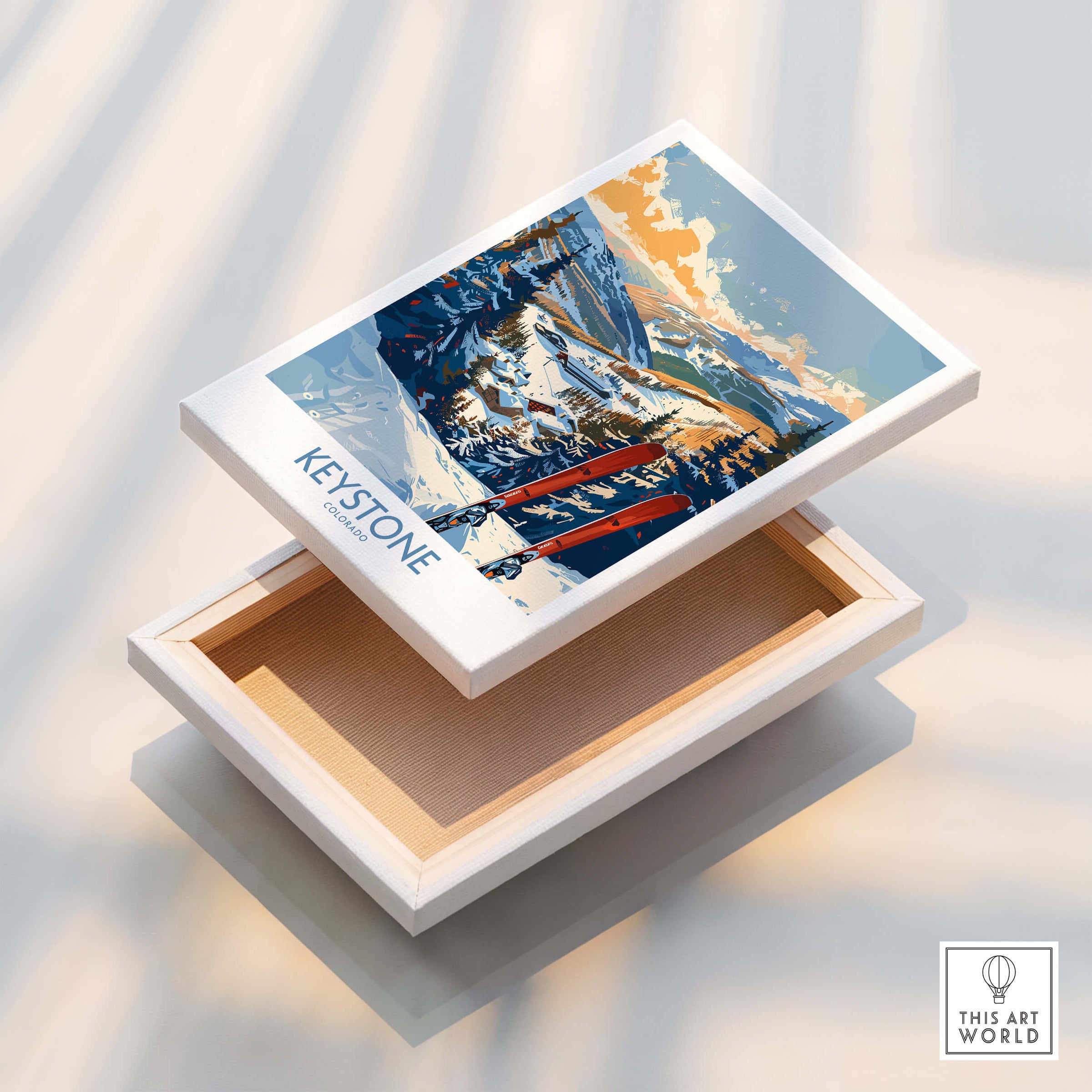Keystone Wall Art Poster - Colorado Ski Print displayed on a white wooden box, showcasing a beautiful winter landscape.