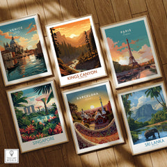 Set of six framed travel posters featuring Venice, Kings Canyon, Paris, Singapore, Barcelona, and Sri Lanka on a wooden floor.