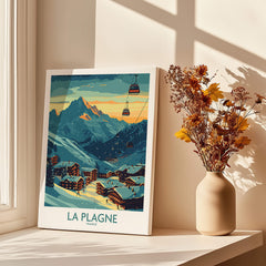 La Plagne Poster France displayed next to flowers in a vase, showcasing the beautiful French Alps landscape.