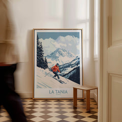 Ski Poster La Tania France showcasing a skier on the slopes with stunning mountain views in a cozy interior setting.