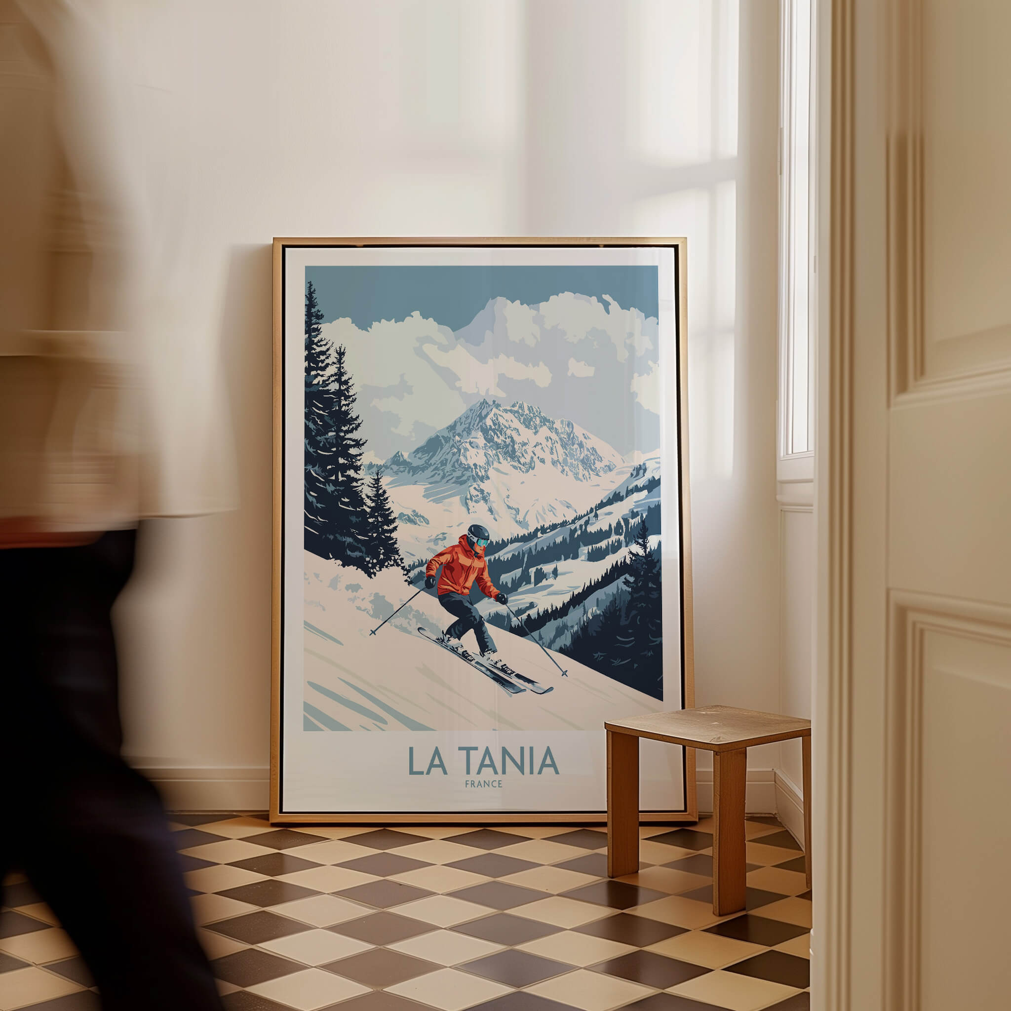 Ski Poster La Tania France showcasing a skier on the slopes with stunning mountain views in a cozy interior setting.