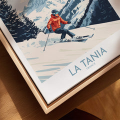 Ski Poster La Tania France featuring a skier in an orange jacket on snowy slopes with scenic mountains in the background.