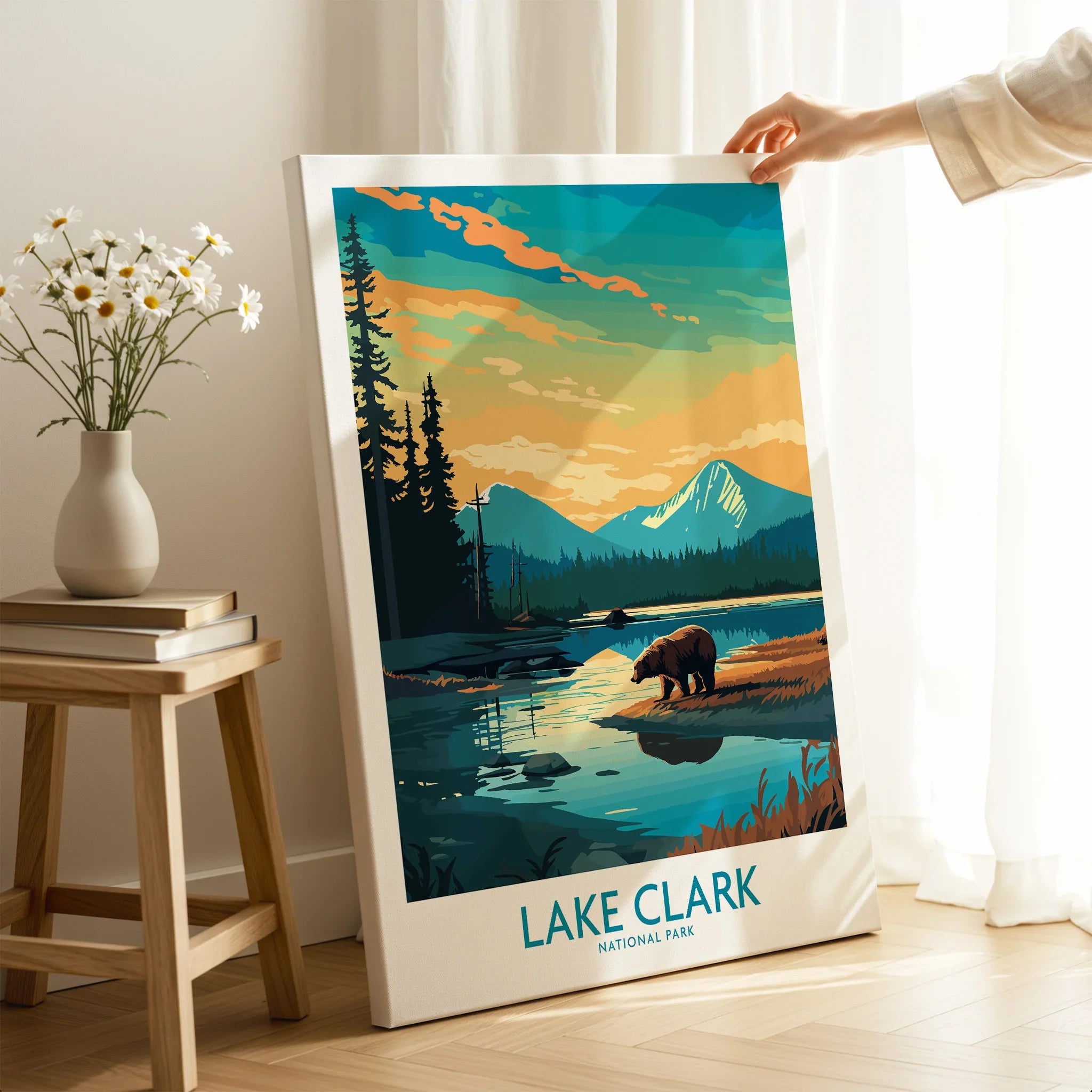 Lake Clark National Park print with bear, mountains, and lake, held in cozy home setting