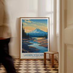 Framed Lassen Volcanic National Park travel poster on floor in stylish hallway, man walking past.