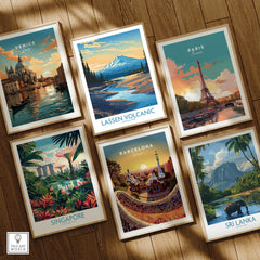 Set of six framed travel art prints on wooden floor featuring Venice, Lassen Volcanic, Paris, Singapore, Barcelona, and Sri Lanka.