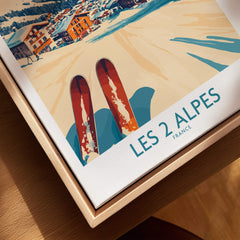 Les 2 Alpes Ski Poster Print showcasing skis on snow with vibrant artwork and French mountains in the background.
