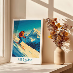 Les 2 Alpes Wall Art Ski Poster featuring a skier and snowy mountains in a bright design.