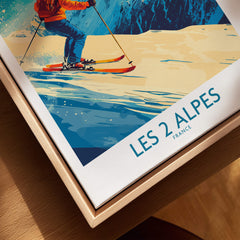 Les 2 Alpes Wall Art Ski Poster showcasing a vibrant skier design against a scenic snowy backdrop.