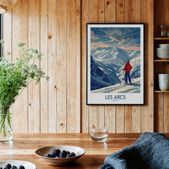 Les Arcs Ski Print - France framed print on a wooden wall showcasing a skier in the stunning mountains of France