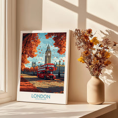 London Travel Poster featuring a red double-decker bus, Big Ben, and autumn leaves in a cozy home setting.