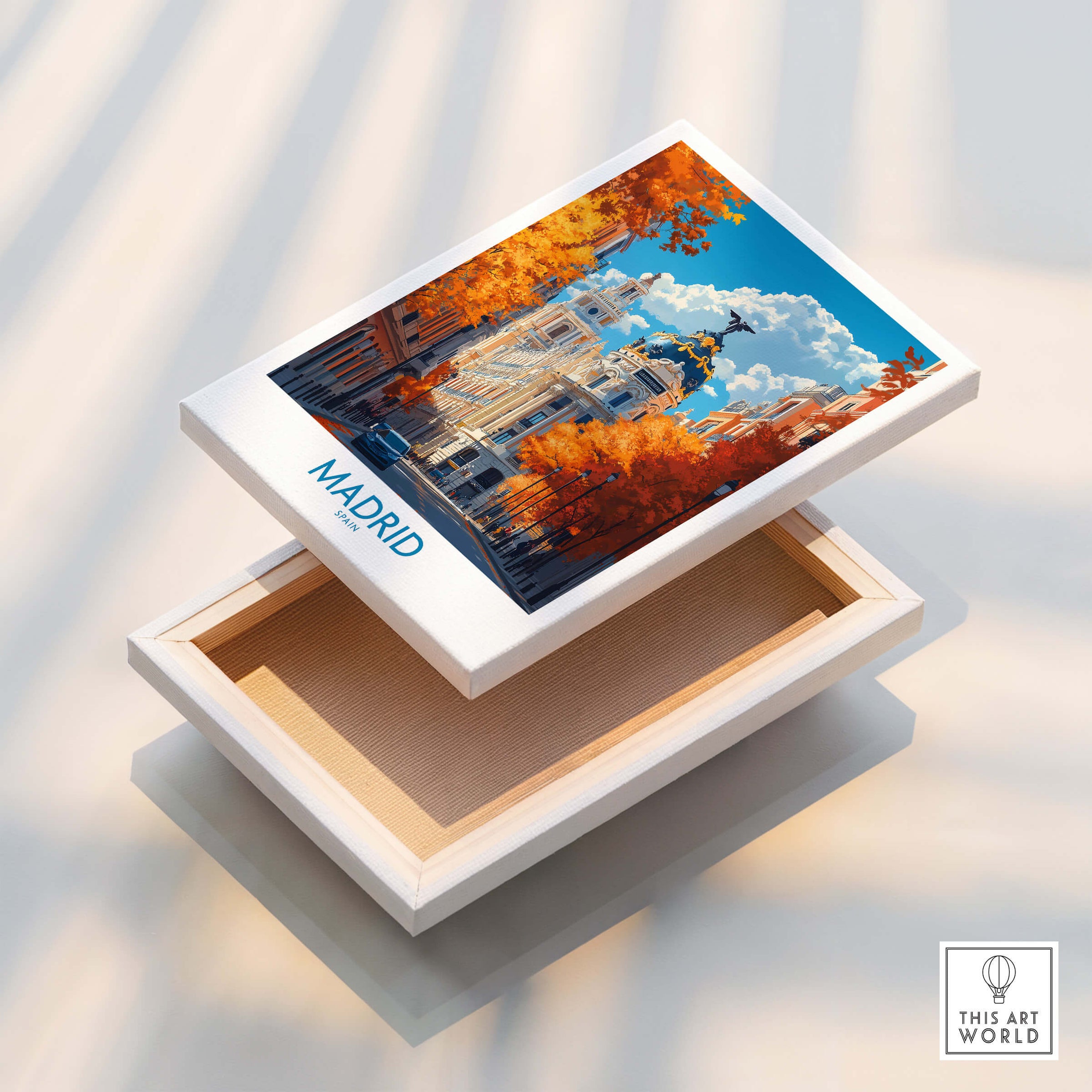 Madrid Wall Art Print displayed on a wooden box with vibrant autumn colors and Spanish architecture.