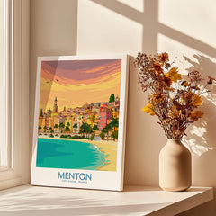 Menton Cote d'Azur Poster Print showcasing the vibrant sunset over Menton's charming coastline and colorful buildings.