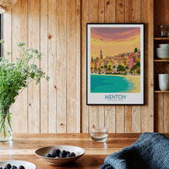 Menton Cote d'Azur Poster Print displayed in a stylish room with wooden decor and plants.