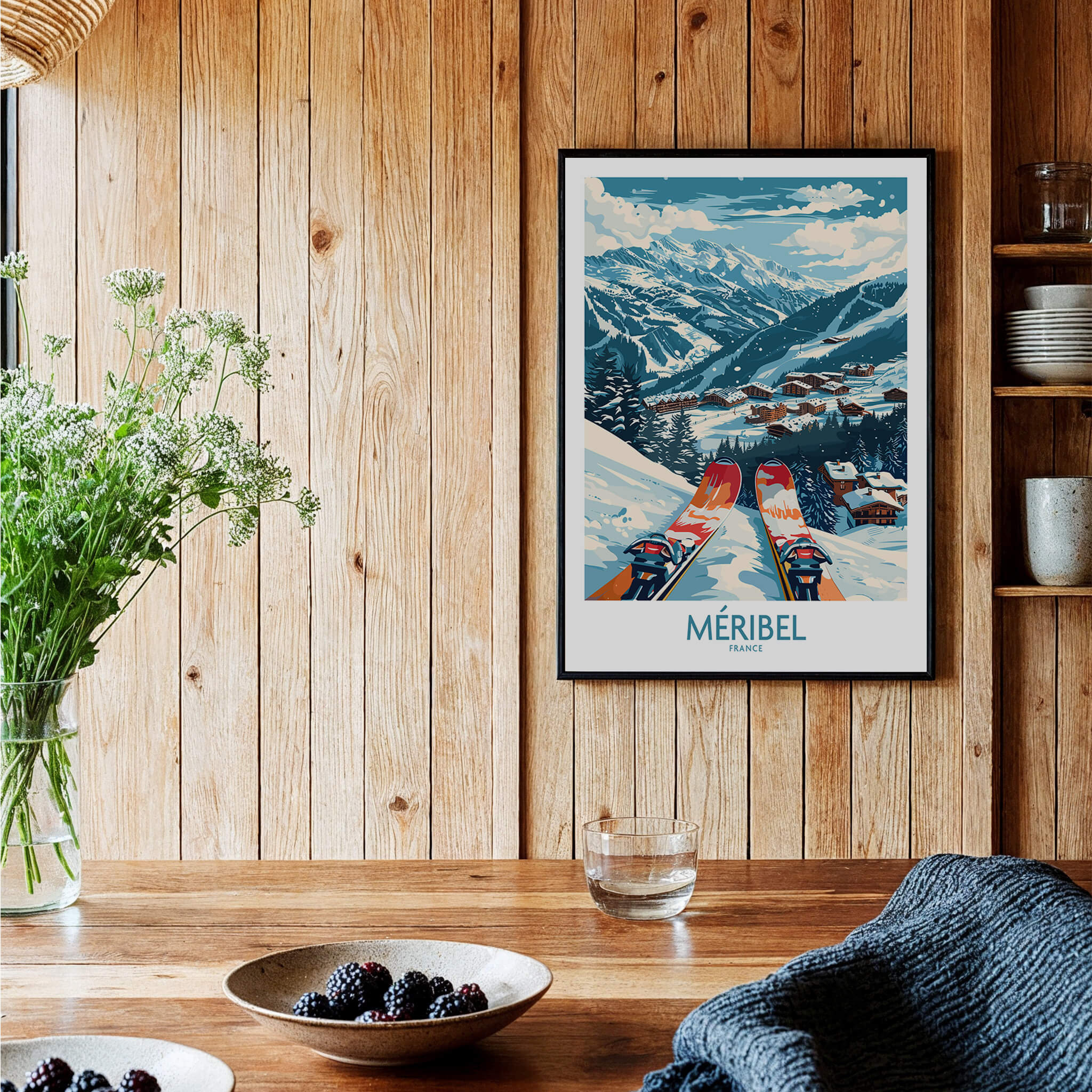 Meribel Wall Art Ski Print -  France displayed in a cozy interior with wooden decor and tableware.