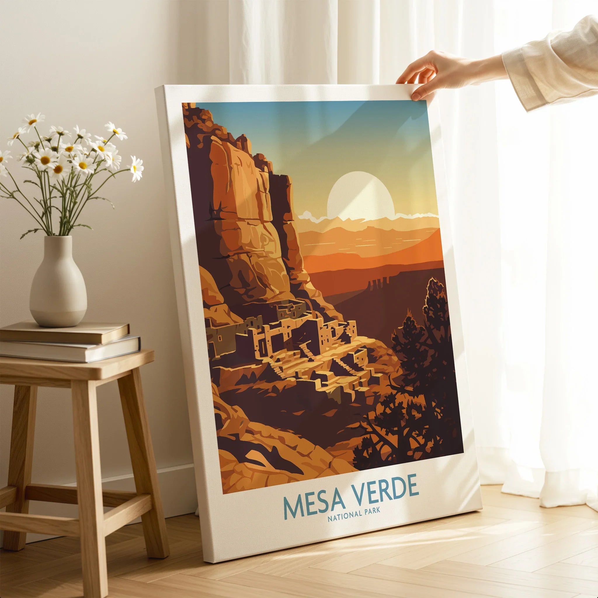 Mesa Verde National Park art print with sunset, held in a bright modern room.