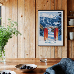 Ski Poster Morillon France featuring picturesque snowy slopes and vibrant red skis framed on a wooden wall.
