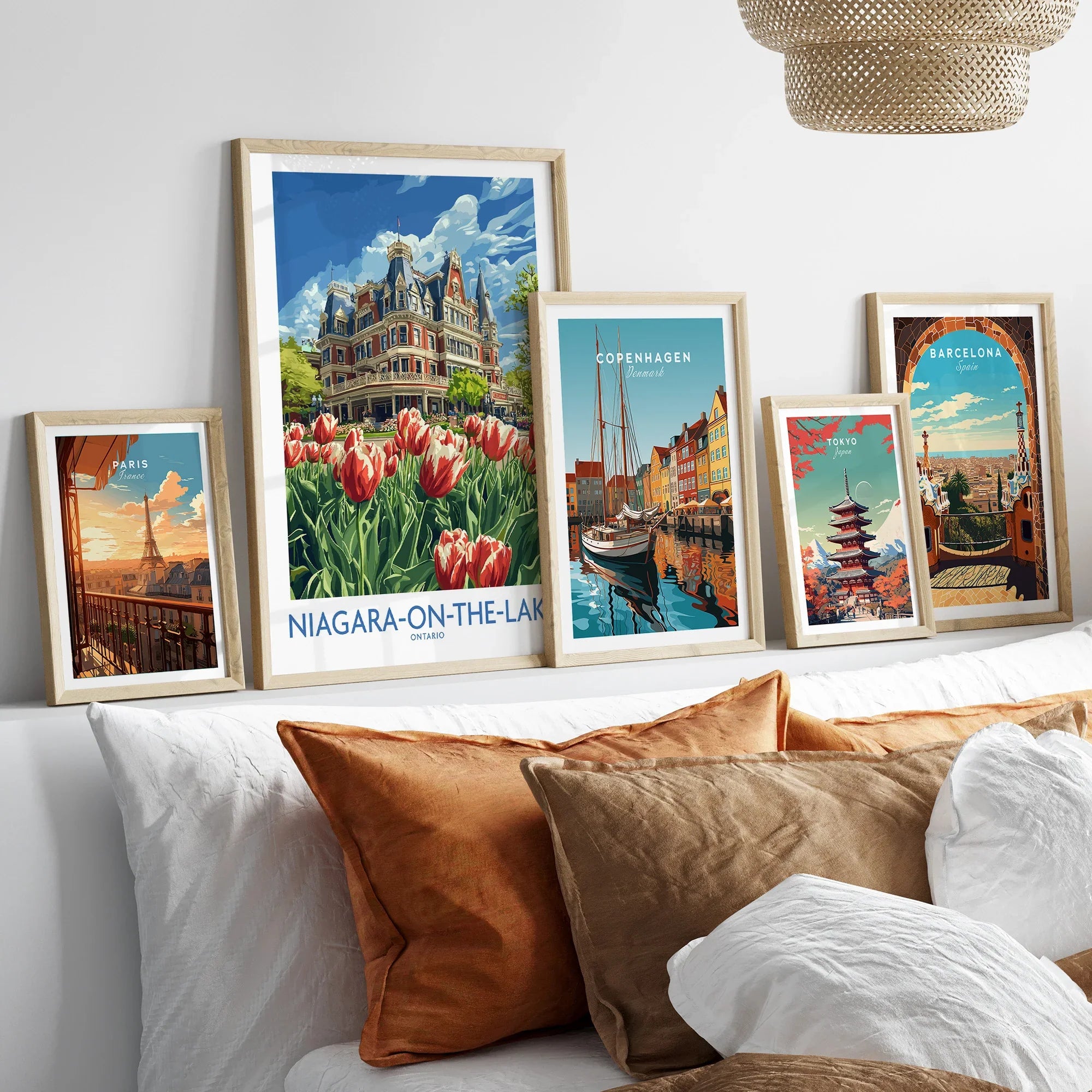 Framed travel posters of Paris, Niagara-on-the-Lake, Copenhagen, Tokyo, and Barcelona for wall art decor