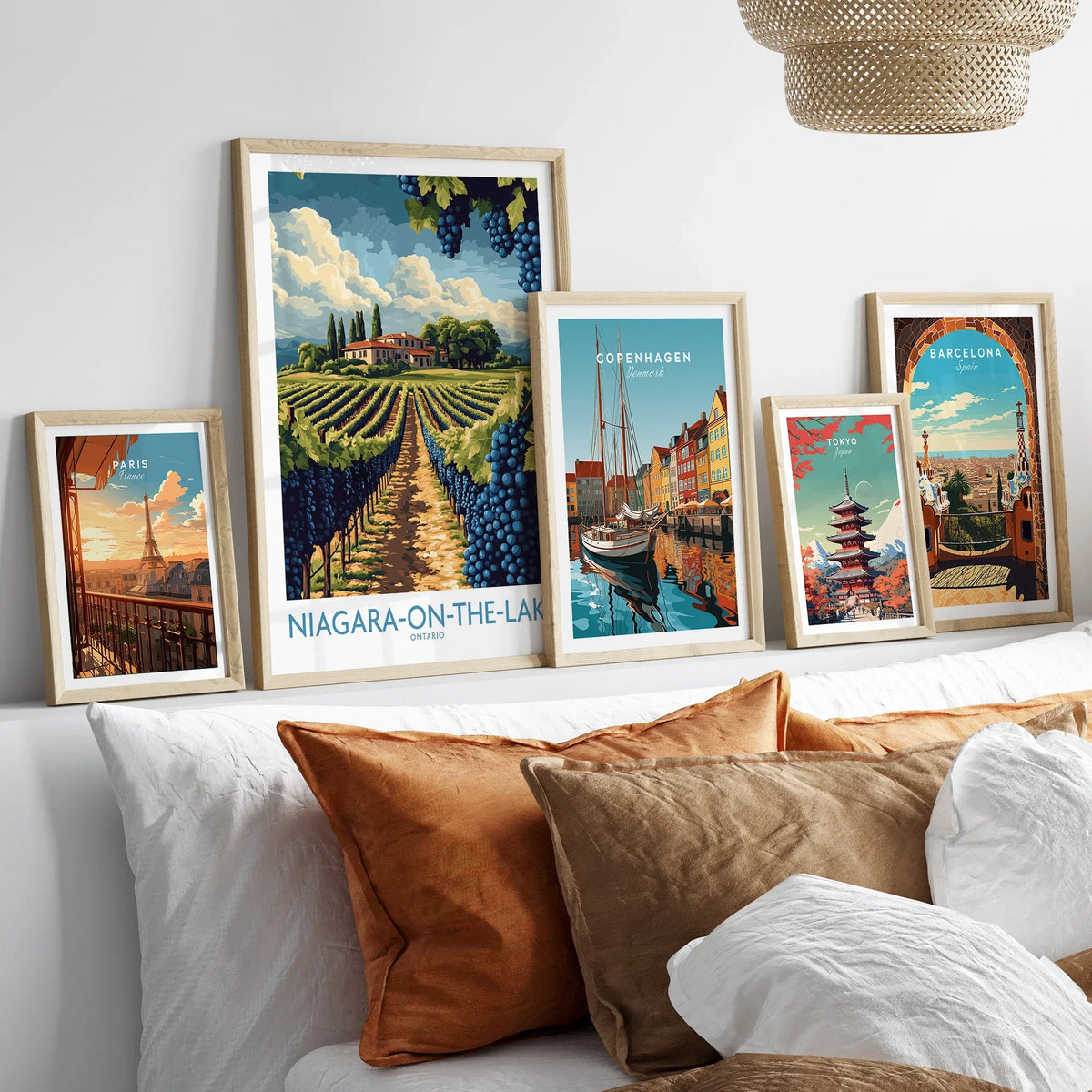 Framed travel posters of Paris, Niagara-on-the-Lake, Copenhagen, Tokyo, and Barcelona for wall art decor