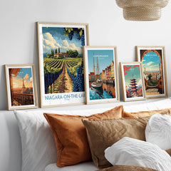 Framed travel posters of Paris, Niagara-on-the-Lake, Copenhagen, Tokyo, and Barcelona for wall art decor
