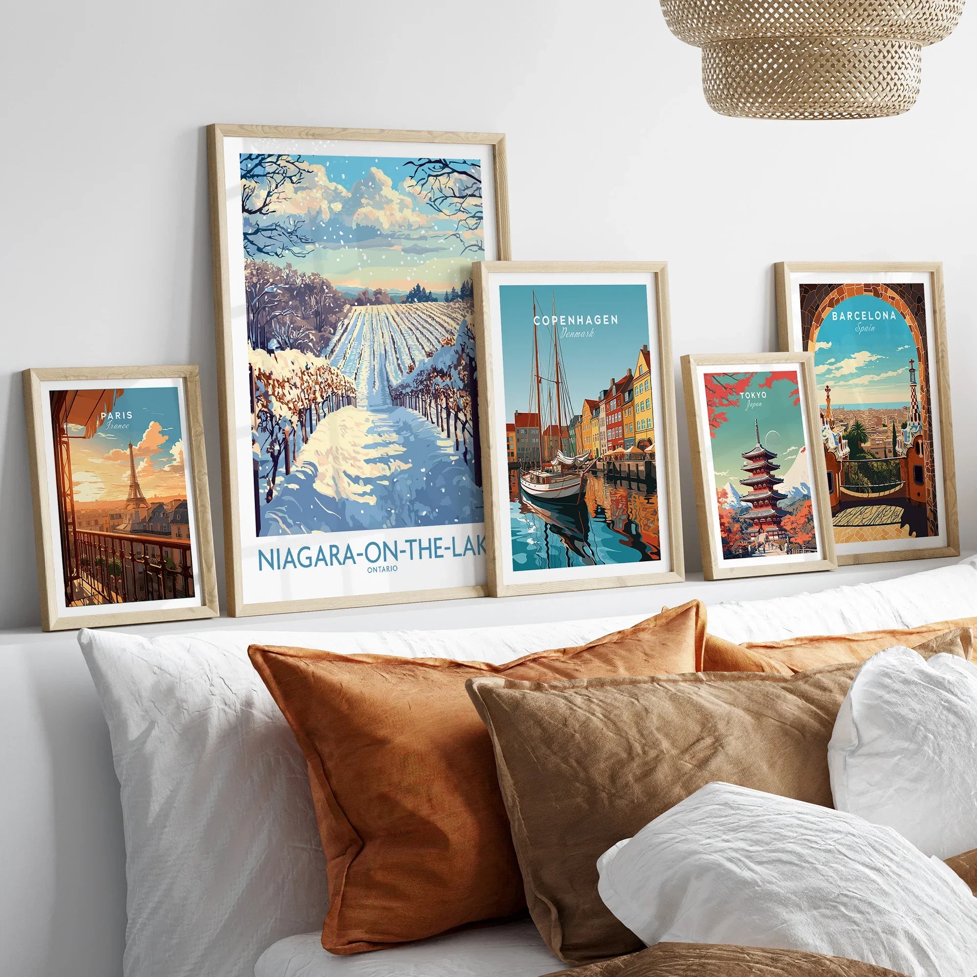 Framed travel posters of Paris, Niagara-on-the-Lake, Copenhagen, Tokyo, and Barcelona for wall art decor