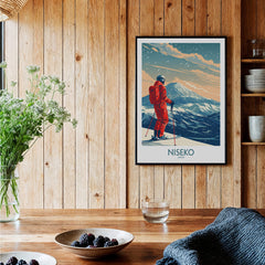 Niseko Ski Print -  Japan displayed in a cozy interior with a wooden wall and a skier silhouette.