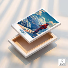Niseko Wall Art Print - Ski Poster Japan displayed on a wooden box, showcasing a vibrant ski scene in Japan.