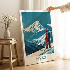 Niseko Art Print - Ski Poster Japan showcasing a skier against a snow-covered mountain in a cozy interior setting.