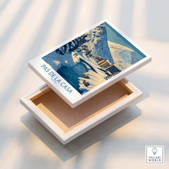 Pas de la Casa Andorra Art Print | Winter Village Bridge Poster displayed on a wooden box.
