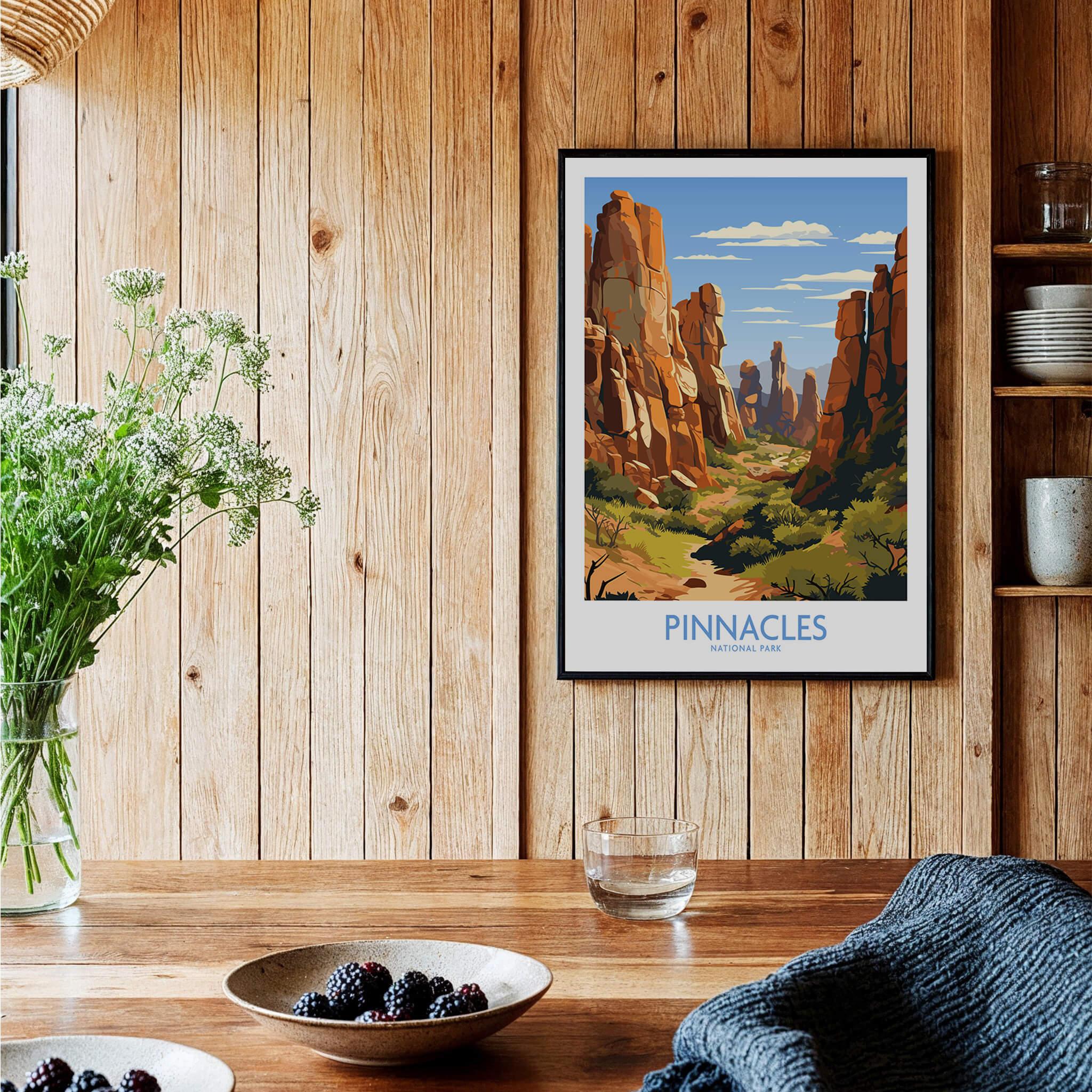 Pinnacles National Park art print in black frame on rustic kitchen wall, with bowls of berries.