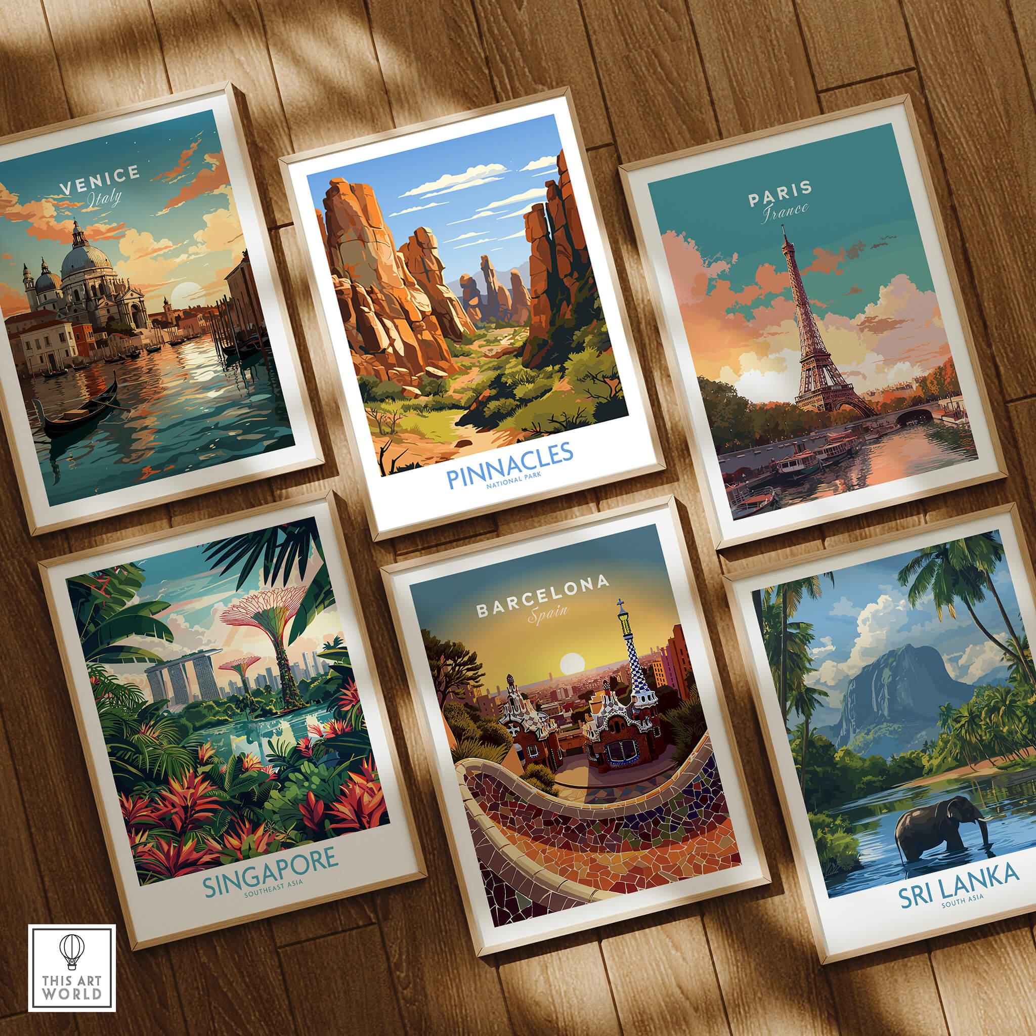 Set of six framed travel posters featuring Venice, Paris, Singapore, Pinnacles, Barcelona, and Sri Lanka on a wooden floor