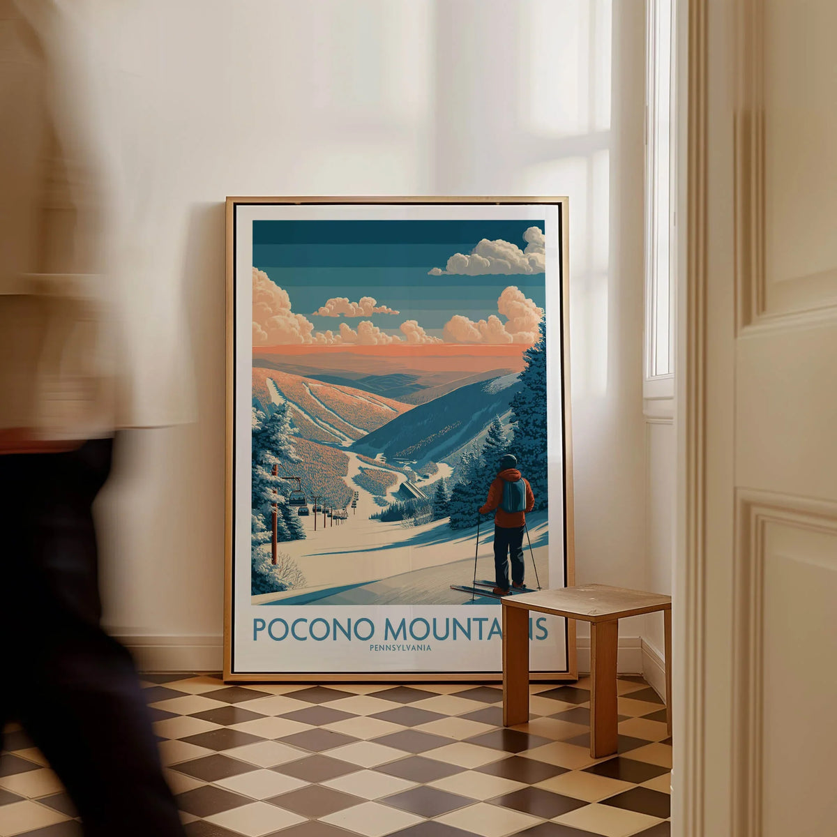 Framed Pocono Mountains ski travel poster with skier and snowy landscape in modern hallway