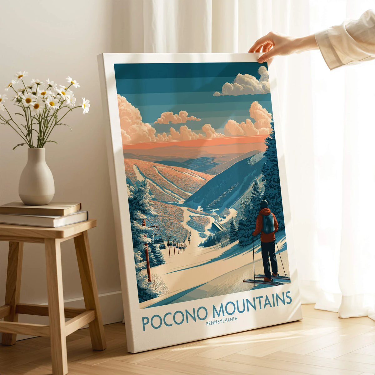 Pocono Mountains ski resort travel poster leaning against wall, skier and snowy landscape featured.
