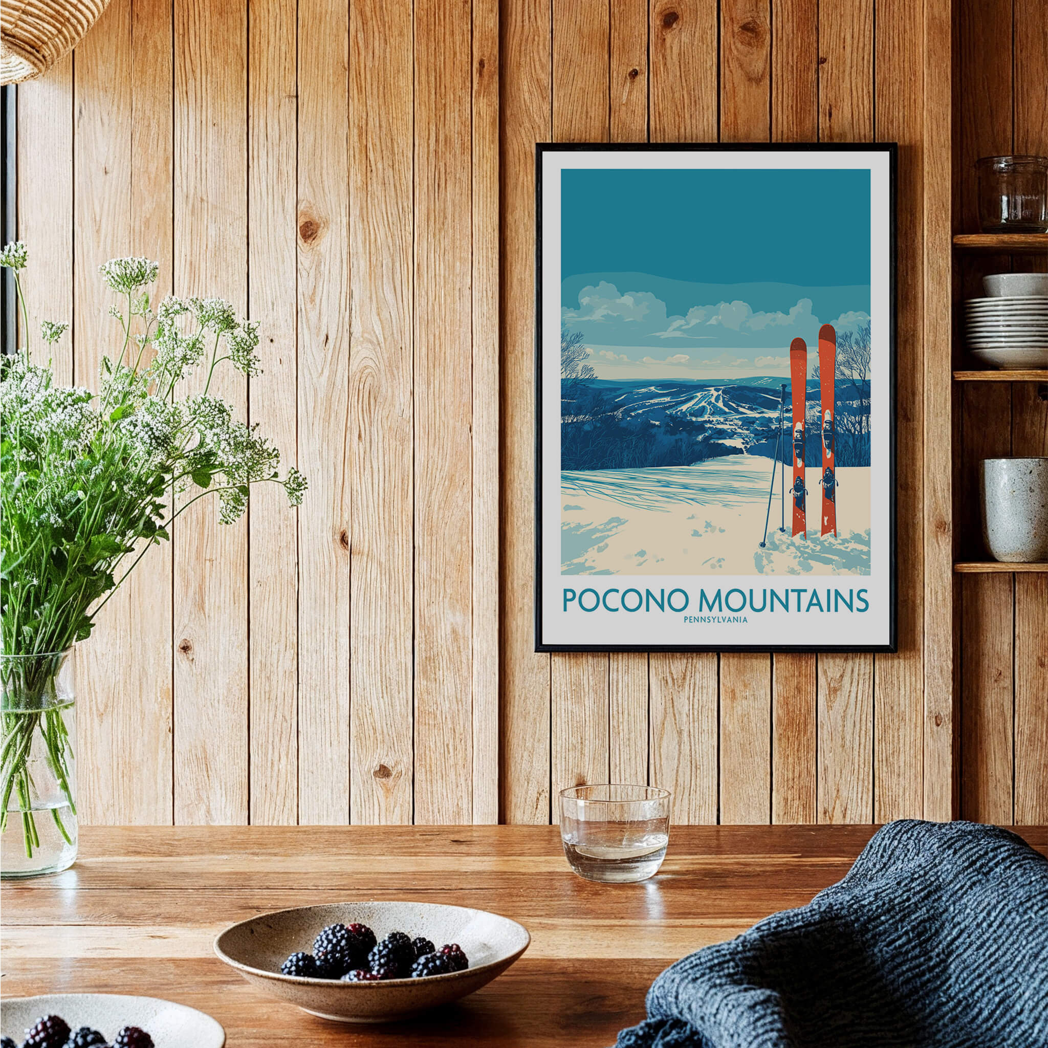 Pocono Mountains travel poster wall art with skis in a cozy rustic kitchen setting