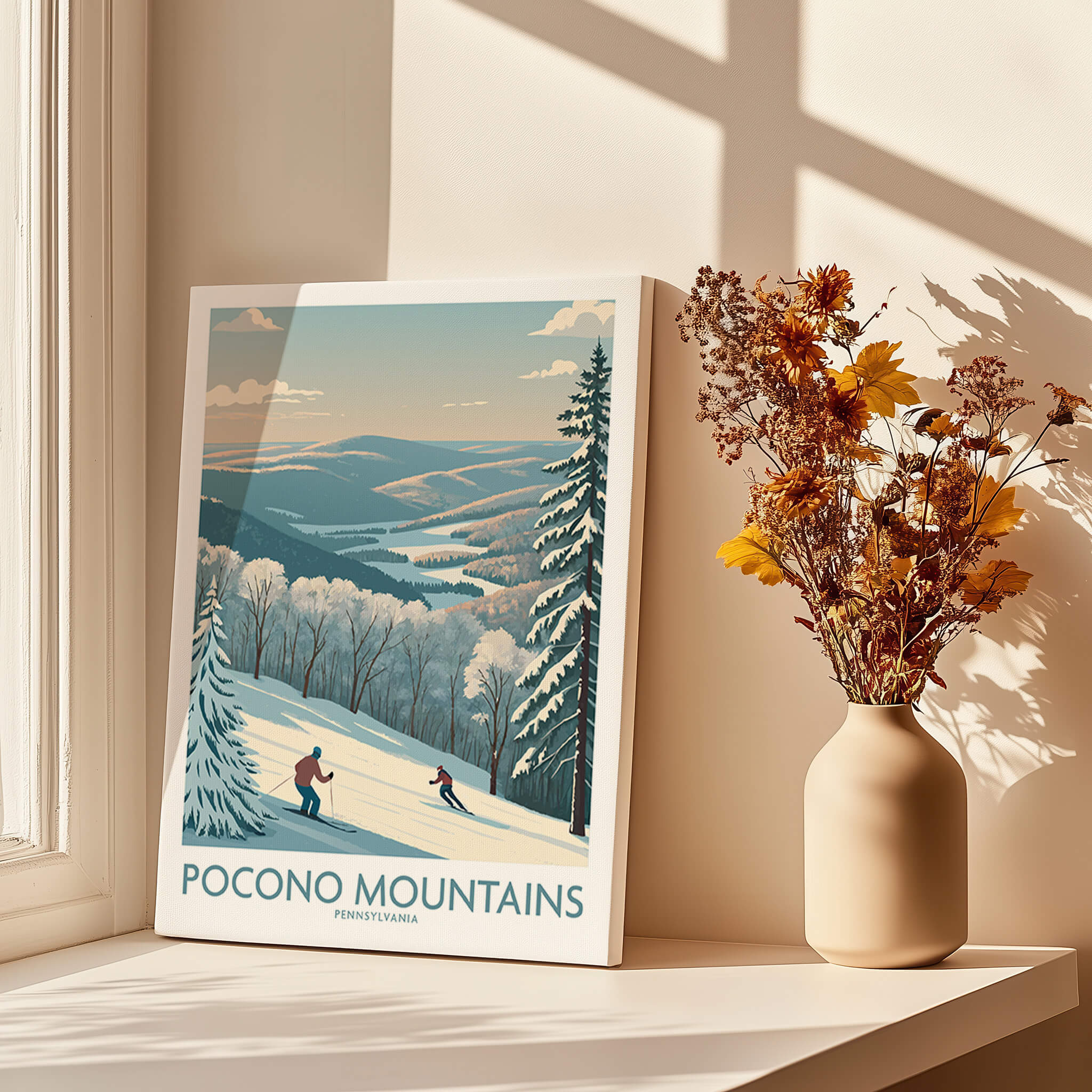 Pocono Mountains ski art print with skiers and winter landscape on a sunlit windowsill