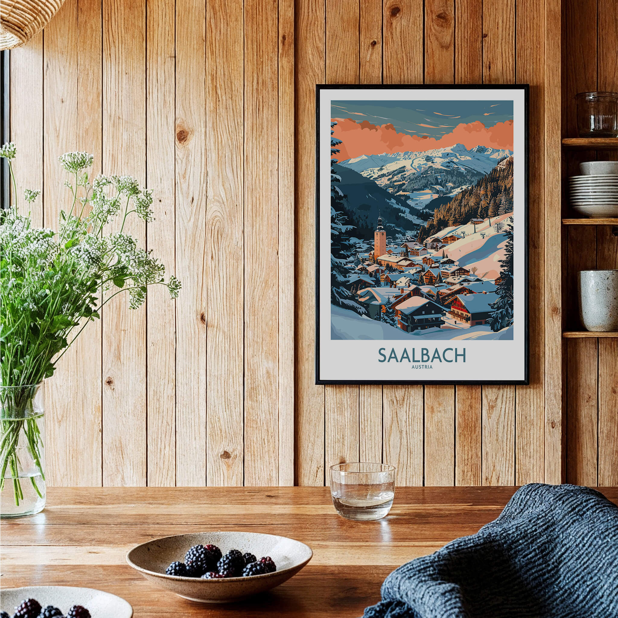 Saalbach Wall Art Poster showcasing a stunning ski print in a cozy indoor setting with wooden decor.